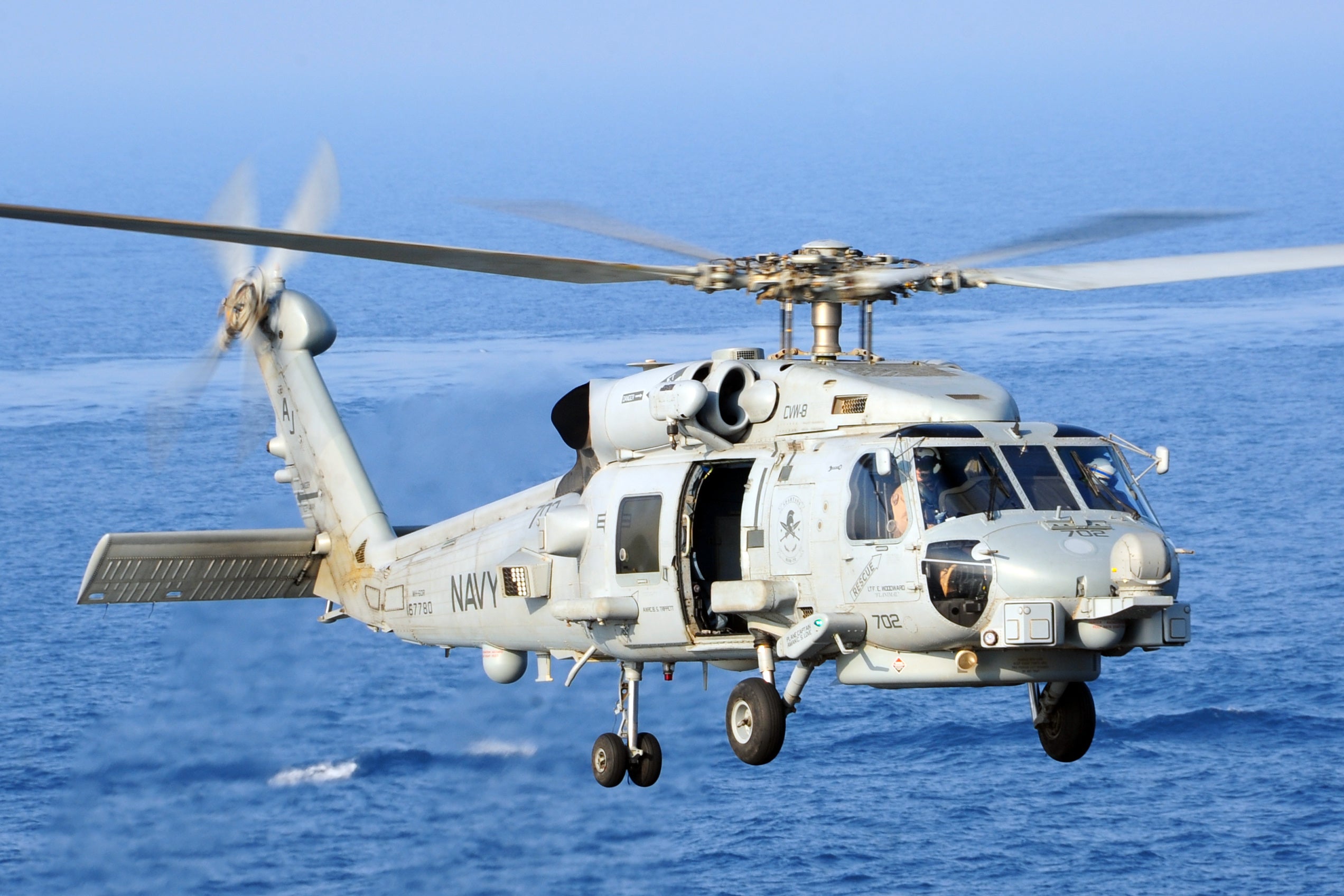 US Navy MH-60R Seahawk maritime helicopter takes off from a carrier flight deck. The MH-60R is flown by the US Navy and the Royal Danish Air Force, whose aircrew took part in the trial that named the Neck Flex harness.