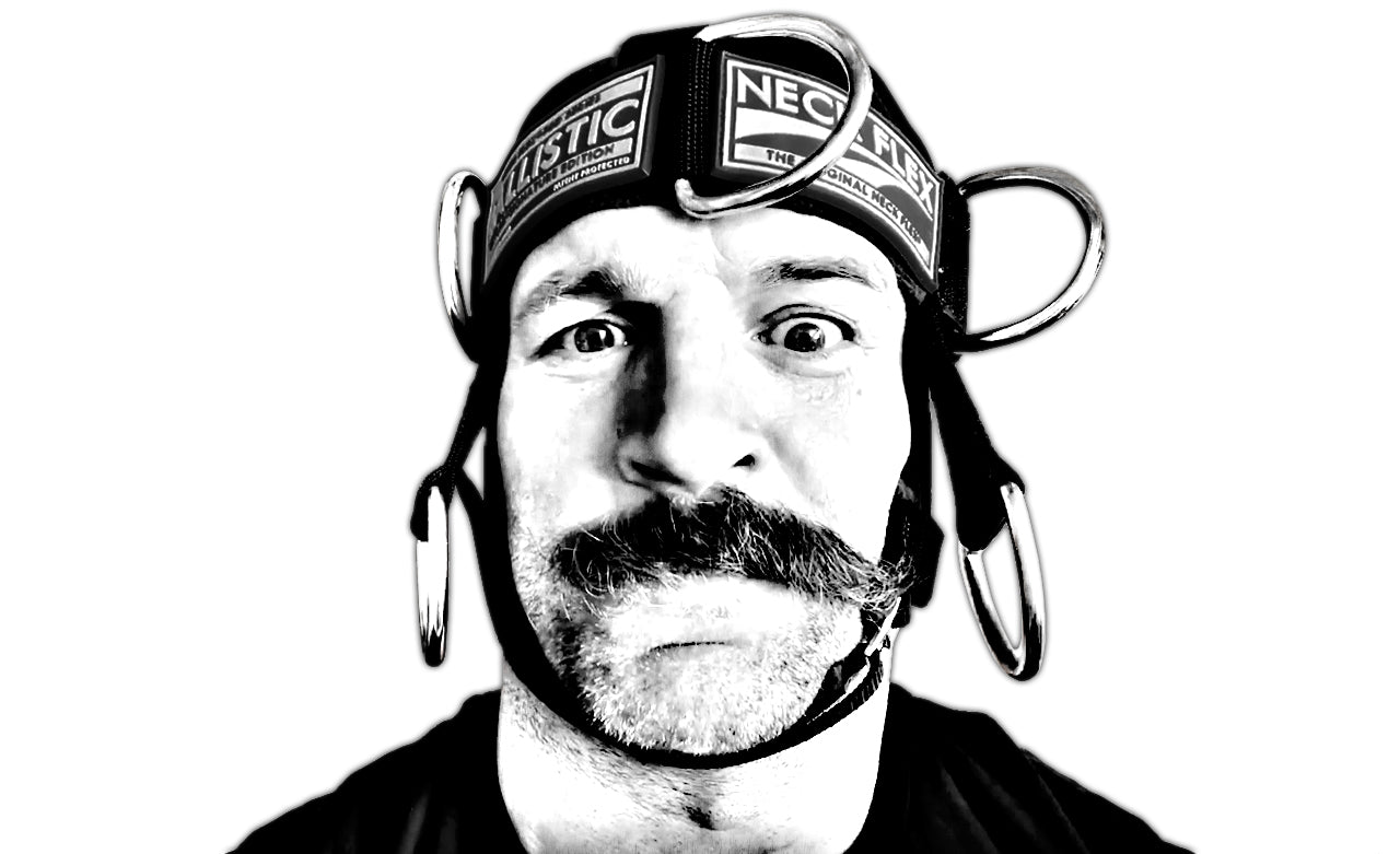 Athlete wearing the Neck Flex Ballistic Kevlar neck harness with chains attached, black and white portrait