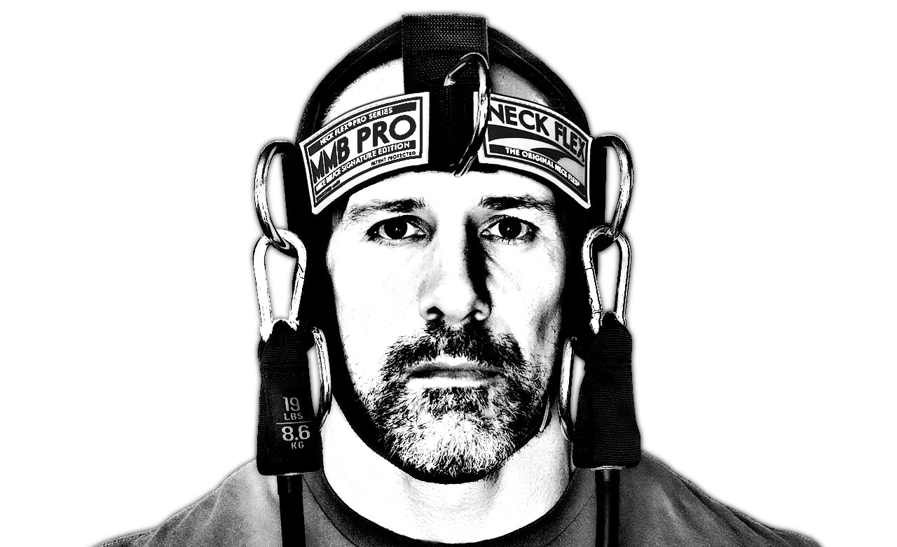 Mike Bruce wearing the Neck Flex MMB Pro neck harness, front view, black and white
