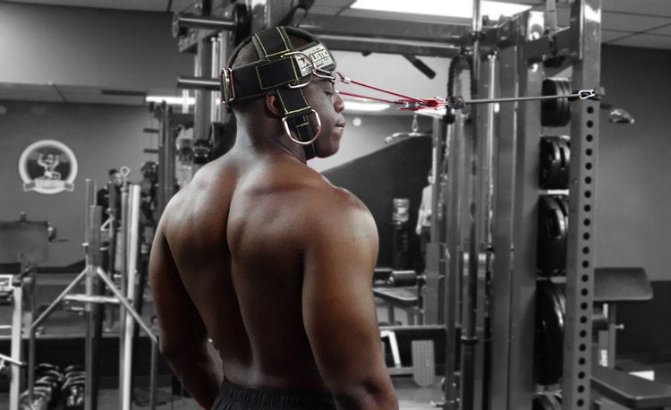 Person wearing boxing gear in a gym setting